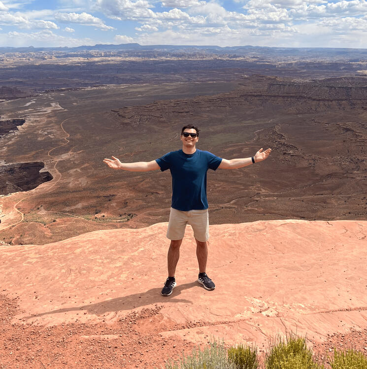 Treverse standing in front of a canyon.