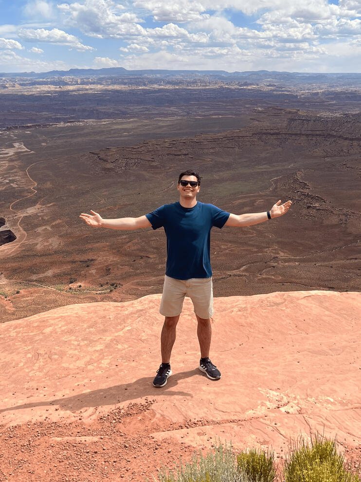 Treverse standing in front of a canyon.