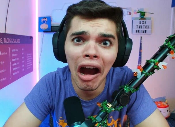 Treverse staring into the camera with a scared expression.